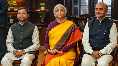 Union Finance Minister Nirmala Sitharaman with Ministers of State Pankaj Chaudhary and Bhagwat Karad a day before presentation of the Interim Budget 2024. (PTI) Union Finance Minister Nirmala Sitharaman with Ministers of State Pankaj Chaudhary and Bhagwat Karad a day before presentation of the Interim Budget 2024. (PTI)