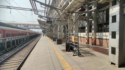 Several spots on the platform are not yet covered and tin sheets have not yet been installed on the roof due to which passengers have to stand in the sunlight under high-tension wires. (HT PHOTO)