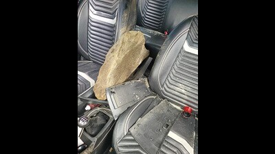 The boulder inside the car after mishap in Mandi on Wednesday. (Birbal Sharma/HT)