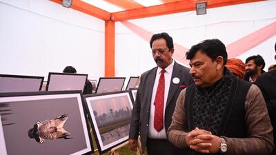 Uttar Pradesh’s forest and environment minister Malik views a photo exhibition, held on the sidelines Nature and Bird Festival at Surajput wetland in Greater Noida on Wednesday. (Sunil Ghosh /HT Photo) Uttar Pradesh’s forest and environment minister Malik views a photo exhibition, held on the sidelines Nature and Bird Festival at Surajput wetland in Greater Noida on Wednesday. (Sunil Ghosh /HT Photo)