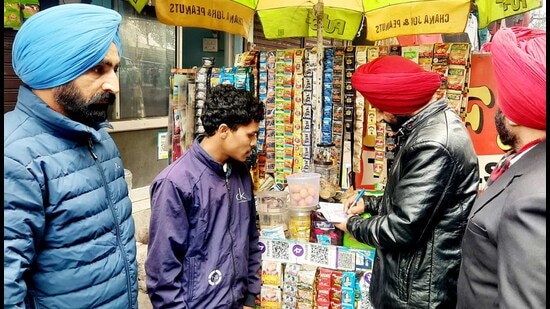 A team from the Ludhiana civil surgeon’s office checks shopkeepers who violated the Tobacco Control Act (COTPA) in Ludhiana on Wednesday. (HT Photo)