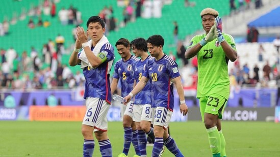 Japan's players greet their supporters after the Qatar 2023 AFC Asian Cup football match against Bahrain (AFP)
