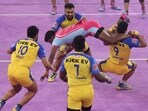 Players of Jaipur Pink Panthers and Tamil Thalaivas in action