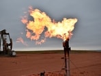 FILE - A flare burns natural gas at an oil well Aug. 26, 2021, in Watford City, N.D. Oil and natural gas companies would have to pay a fee for methane emissions that exceed certain levels under a new rule proposed by the Biden administration. The rule, announced in December 2023, includes a two-year phase-in period for companies to eliminate routine flaring of natural gas from new oil wells. (AP Photo/Matthew Brown, File) FILE - A flare burns natural gas at an oil well Aug. 26, 2021, in Watford City, N.D. Oil and natural gas companies would have to pay a fee for methane emissions that exceed certain levels under a new rule proposed by the Biden administration. The rule, announced in December 2023, includes a two-year phase-in period for companies to eliminate routine flaring of natural gas from new oil wells. (AP Photo/Matthew Brown, File)