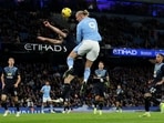 Manchester City's Erling Braut Haaland in action with Burnley's Dara O'Shea