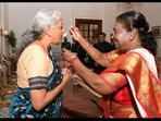 President Droupadi Murmu feeding dahi cheeni to FM Nirmala Sitharaman. 