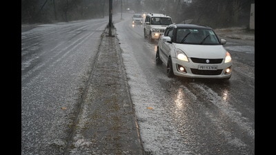 A road covered with hail in Sector 74, Mohali, on Thursday. (Sanjeev Sharma/HT)