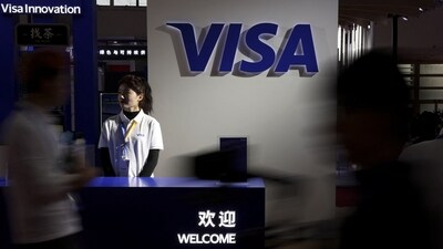 People walk past the Visa logo at its booth during the first China International Supply Chain Expo (CISCE) in Beijing, China November 28, 2023. REUTERS/Florence Lo (REUTERS)