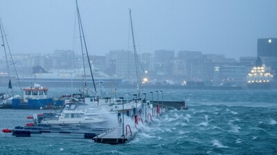 Boats sway in the harbour as waves batter a dock during Storm Ingunn in Bodo, Norway (via REUTERS)