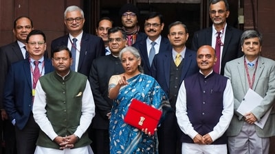 Union Finance Minister Nirmala Sitharaman with Ministers of State Bhagwat Kishanrao Karad and Pankaj Chaudhary, and other officials. (PTI) Union Finance Minister Nirmala Sitharaman with Ministers of State Bhagwat Kishanrao Karad and Pankaj Chaudhary, and other officials. (PTI)