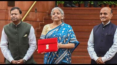 Finance minister Nirmala Sitharaman (C) along with the Ministers of State for Finance Pankaj Chaudhary (L) and Bhagwat Kishanrao Karad before presenting the annual budget in the Parliament in New Delhi. Experts have hailed Centre’s plans for setting up more medical colleges, but expressed disappointment of provisions being less as compared to previous two years. (AFP) Finance minister Nirmala Sitharaman (C) along with the Ministers of State for Finance Pankaj Chaudhary (L) and Bhagwat Kishanrao Karad before presenting the annual budget in the Parliament in New Delhi. Experts have hailed Centre’s plans for setting up more medical colleges, but expressed disappointment of provisions being less as compared to previous two years. (AFP)