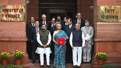 MoS finance Bhagwat Karad and Pankaj Chaudhary also accompanied her to the finance ministry. (AFP) MoS finance Bhagwat Karad and Pankaj Chaudhary also accompanied her to the finance ministry. (AFP)