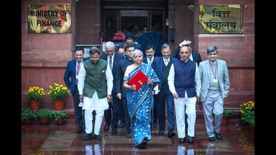 Nirmala Sitharaman, Union Minister of Finance along with Bhagwat Karad and Pankaj Chaudhary MOS Finance leaves the Finance Ministry carrying the Finance Budget ahead of the presentation of interim Budget 2024 in Parliament at North Block in New Delhi, India, on Thursday. (HT) Nirmala Sitharaman, Union Minister of Finance along with Bhagwat Karad and Pankaj Chaudhary MOS Finance leaves the Finance Ministry carrying the Finance Budget ahead of the presentation of interim Budget 2024 in Parliament at North Block in New Delhi, India, on Thursday. (HT)