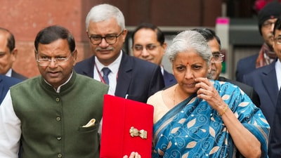 Union finance minister Nirmala Sitharaman and other officials outside the Finance Ministry. (PTI) Union finance minister Nirmala Sitharaman and other officials outside the Finance Ministry. (PTI)