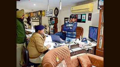 Police officials scanning CCTV to trace murder accused in Ludhiana. (HT)