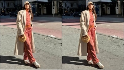 Her last look served as a lesson in winter layering, as Shanaya dressed in a stylish orange co-ord set consisting of a high-neck printed zip-up jacket and matching trousers. She added a beige trench coat to perfectly complete the look. (Instagram/@shanayakapoor02) Her last look served as a lesson in winter layering, as Shanaya dressed in a stylish orange co-ord set consisting of a high-neck printed zip-up jacket and matching trousers. She added a beige trench coat to perfectly complete the look. (Instagram/@shanayakapoor02)