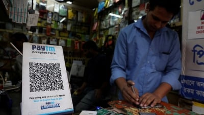 Paytm shares: A QR code of Paytm is seen at a mobile repairing shop in Kolkata. (REUTERS)