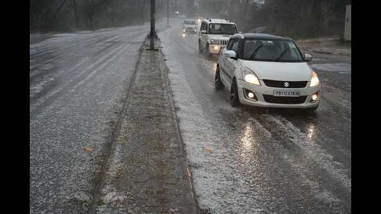 A road covered with hail in Sector 74, Mohali, on Thursday. (Sanjeev Sharma/HT)