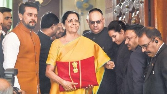 In 2020, Sitharaman wore a yellow-gold silk saree with a blue border and matching blouse. The yellow color symbolizes prosperity, and during the pandemic, it reflected hope for economic growth and development.&nbsp;(File Photo)