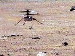 This NASA photo obtained May 23, 2021 shows NASA's Ingenuity Mars Helicopter  as it lands with a soft bounce