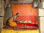 A priest offers prayers at 'Vyas Ji Ki Tehkhana' after the Varanasi court's judgment to allow Hindu devotees to worship inside the sealed basement of the Gyanvapi mosque complex, in Varanasi on Thursday. 