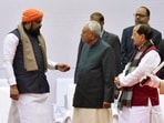 Bihar chief minister Nitish Kumar with deputy chief ministers Samrat Choudhary and Vijay Kumar Sinha during death anniversary function of Mahatma Gandhi at Gandhi Ghat in Patna, Bihar,