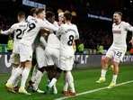 Manchester United's Kobbie Mainoo celebrates scoring their fourth goal with teammates 
