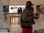 People walk by an Apple store in a shopping mall in lower Manhattan. People walk by an Apple store in a shopping mall in lower Manhattan.
