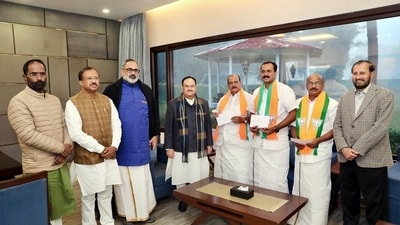 BJP chief JP Nadda welcomes Kerala Janapaksham (Secular) leader P C George, his son Shone George and others as the party merges with the BJP on Wednesday. Union ministers Rajeev Chandrasekhar, V Muraleedharan and others also present. (ANI) (HT_PRINT) BJP chief JP Nadda welcomes Kerala Janapaksham (Secular) leader P C George, his son Shone George and others as the party merges with the BJP on Wednesday. Union ministers Rajeev Chandrasekhar, V Muraleedharan and others also present. (ANI) (HT_PRINT)