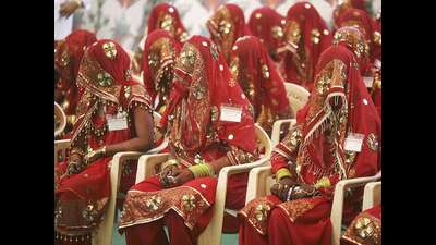 Brides-wait-for-the-start-of-their-mass-marriage-ceremony-in-Ahmedabad (For representation)