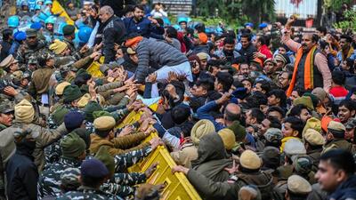 Delhi Police and paramilitary forces try to stop BJP supporters staging a protest against the Delhi government for alleged corruption, outside the Aam Admi Party office on Friday. (Raj K Raj/HT Photo) Delhi Police and paramilitary forces try to stop BJP supporters staging a protest against the Delhi government for alleged corruption, outside the Aam Admi Party office on Friday. (Raj K Raj/HT Photo)