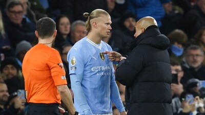 Manchester City's Pep Guardiola (R) speaks to Erling Haaland. (AFP) Manchester City's Pep Guardiola (R) speaks to Erling Haaland. (AFP)