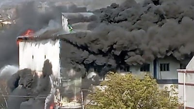 Fire tenders dousing the flames at Aroma Cosmetic in Jharmajri village, in Baddi on Friday. (ANI) Fire tenders dousing the flames at Aroma Cosmetic in Jharmajri village, in Baddi on Friday. (ANI)