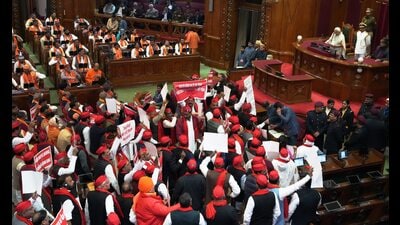 Samajwadi Party MLAs and MLCs raise slogans during a joint sitting of Uttar Pradesh Legislative Assembly on the first day of the Budget session, in Lucknow. (PTI)