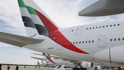 Emirates pre-approved visas for Indians: Attendees walk under the tail of an Airbus A380-800 passenger aircraft, operated by Emirates Airlines, at the Dubai Air Show in Dubai. (Bloomberg) Emirates pre-approved visas for Indians: Attendees walk under the tail of an Airbus A380-800 passenger aircraft, operated by Emirates Airlines, at the Dubai Air Show in Dubai. (Bloomberg)
