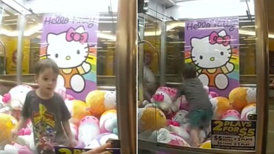 The image shows a 3-year-old kid stuck inside a Hello Kitty claw machine. (Facebook/Queensland Police Service) The image shows a 3-year-old kid stuck inside a Hello Kitty claw machine. (Facebook/Queensland Police Service)