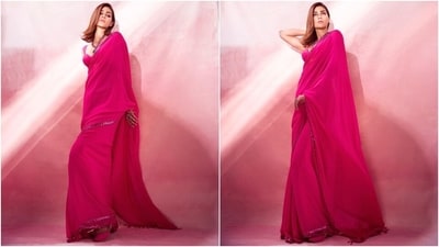 Kriti posted pictures of herself in the hot pink saree on Instagram with the caption, "Taking "Gulaab" a bit too seriously!" The georgette six yards is from designer Arpita Mehta's eponymous label. It features mirrors, sequins and cutdana hand-embroidered work on the borders. Kriti wore it traditionally, with pleats on the front and pallu falling her shoulder in a floor-sweeping length. (Instagram) Kriti posted pictures of herself in the hot pink saree on Instagram with the caption, "Taking "Gulaab" a bit too seriously!" The georgette six yards is from designer Arpita Mehta's eponymous label. It features mirrors, sequins and cutdana hand-embroidered work on the borders. Kriti wore it traditionally, with pleats on the front and pallu falling her shoulder in a floor-sweeping length. (Instagram)