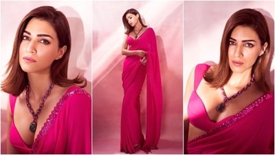 Kriti paired the saree with a matching sleeveless net blouse featuring a plunging neckline and a cropped silhouette. She accessorised the gulabi ensemble with a precious necklace decked with an emerald stone, a matching ring, and embellished hot pink-coloured high-heeled pumps. Lastly, smoky eye shadow, darkened brows, pink lip shade, mascara-adorned lashes, side-parted open locks, and a dewy base rounded off the glam picks. (Instagram) Kriti paired the saree with a matching sleeveless net blouse featuring a plunging neckline and a cropped silhouette. She accessorised the gulabi ensemble with a precious necklace decked with an emerald stone, a matching ring, and embellished hot pink-coloured high-heeled pumps. Lastly, smoky eye shadow, darkened brows, pink lip shade, mascara-adorned lashes, side-parted open locks, and a dewy base rounded off the glam picks. (Instagram)