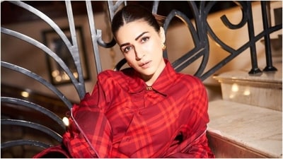Kriti accessorised the outfit with a gold chain-link choker, gold earrings, rings, and black boots. Lastly, she chose a centre-parted top knot, winged eyeliner, subtle eye shadow, mascara on the lashes, darkened brows, mauve lip shade, and a dewy base for the glam picks. (Instagram) Kriti accessorised the outfit with a gold chain-link choker, gold earrings, rings, and black boots. Lastly, she chose a centre-parted top knot, winged eyeliner, subtle eye shadow, mascara on the lashes, darkened brows, mauve lip shade, and a dewy base for the glam picks. (Instagram)