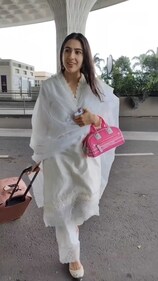 Pick an arm candy like actor Sara Ali Khan, who also chose to add a pop of colour to her white outfit (Photo: Yogen Shah) Pick an arm candy like actor Sara Ali Khan, who also chose to add a pop of colour to her white outfit (Photo: Yogen Shah)