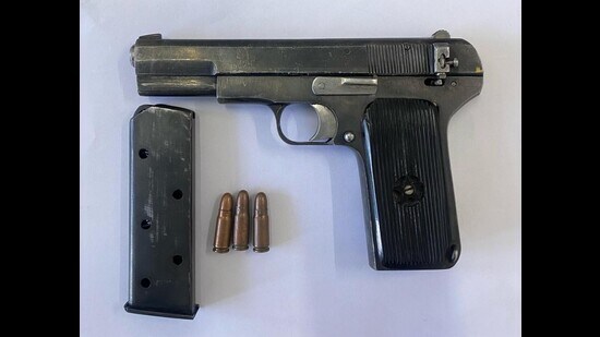 Director general of police (DGP) Gaurav Yadav said the accused has been facing several criminal cases pertaining to murder and attempt to murder. Police teams have also recovered one .30 bore automatic pistol along with a magazine and three live cartridges from his possession. (HT Photo)