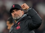 Liverpool's manager Jurgen Klopp celebrates towards his teams fans after the end of the English Premier League soccer match between West Ham United and Liverpool at the London stadium in London, Wednesday, April 26, 2023. Liverpool won the game 2-1. (AP Photo/Alastair Grant)