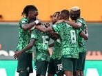 Nigeria's forward #18 Ademola Lookman (C) celebrates scoring his team's first goal with teammates during the Africa Cup of Nations (CAN) 2024 quarter-final football match between Nigeria and Angola