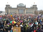 People gather outside the Reichstag building, during a rally of the broad alliance "Hand in Hand" under the slogan "Wir sind die Brandmauer" ("We are the Firewall") to protest against right-wing extremism and for the protection of democracy, in Berlin, Germany 