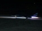  A plane takes off from an unidentified location, as the U.S. launches airstrikes on targets linked to Iran's Revolutionary Guard (IRGC) and the militias it backs, in the screen grab from a handout video