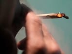 FILE - A Japanese tourist smokes cannabis at a Dutch passion shop(AP Photo/Sakchai Lalit, File) FILE - A Japanese tourist smokes cannabis at a Dutch passion shop(AP Photo/Sakchai Lalit, File)