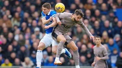 Tottenham's Rodrigo Bentancur, right, jumps for a header with Everton's Dominic Calvert-Lewin during their Premier League match. (AP)