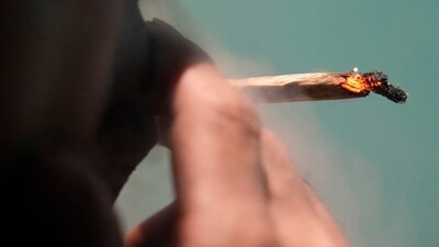 FILE - A Japanese tourist smokes cannabis at a Dutch passion shop(AP Photo/Sakchai Lalit, File) (AP) FILE - A Japanese tourist smokes cannabis at a Dutch passion shop(AP Photo/Sakchai Lalit, File) (AP)