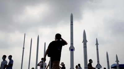People walk past sounding rockets displayed at the China International Aviation and Aerospace Exhibition, in Zhuhai. (Reuters File) People walk past sounding rockets displayed at the China International Aviation and Aerospace Exhibition, in Zhuhai. (Reuters File)