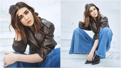 Kriti wore the jacket with high-waisted blue denim jeans featuring side pockets, a boot-cut design, and a fit and flared silhouette. She accessorised the ensemble with minimal additions, including a gold twisted rope choker necklace, black tinted aviators, and matching high-heeled textured boots. (Instagram) Kriti wore the jacket with high-waisted blue denim jeans featuring side pockets, a boot-cut design, and a fit and flared silhouette. She accessorised the ensemble with minimal additions, including a gold twisted rope choker necklace, black tinted aviators, and matching high-heeled textured boots. (Instagram)